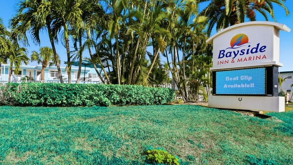 A sign for Bayside Inn & Marina with a digital display. - The Bayside Inn & Marina (Treasure Island)