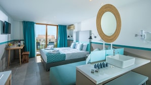 A hotel room with a bed, a desk, a bathroom with a sink and mirror, and a view of the outside. - Solimar Turquoise Adults Only - All Inclusive (Chania)