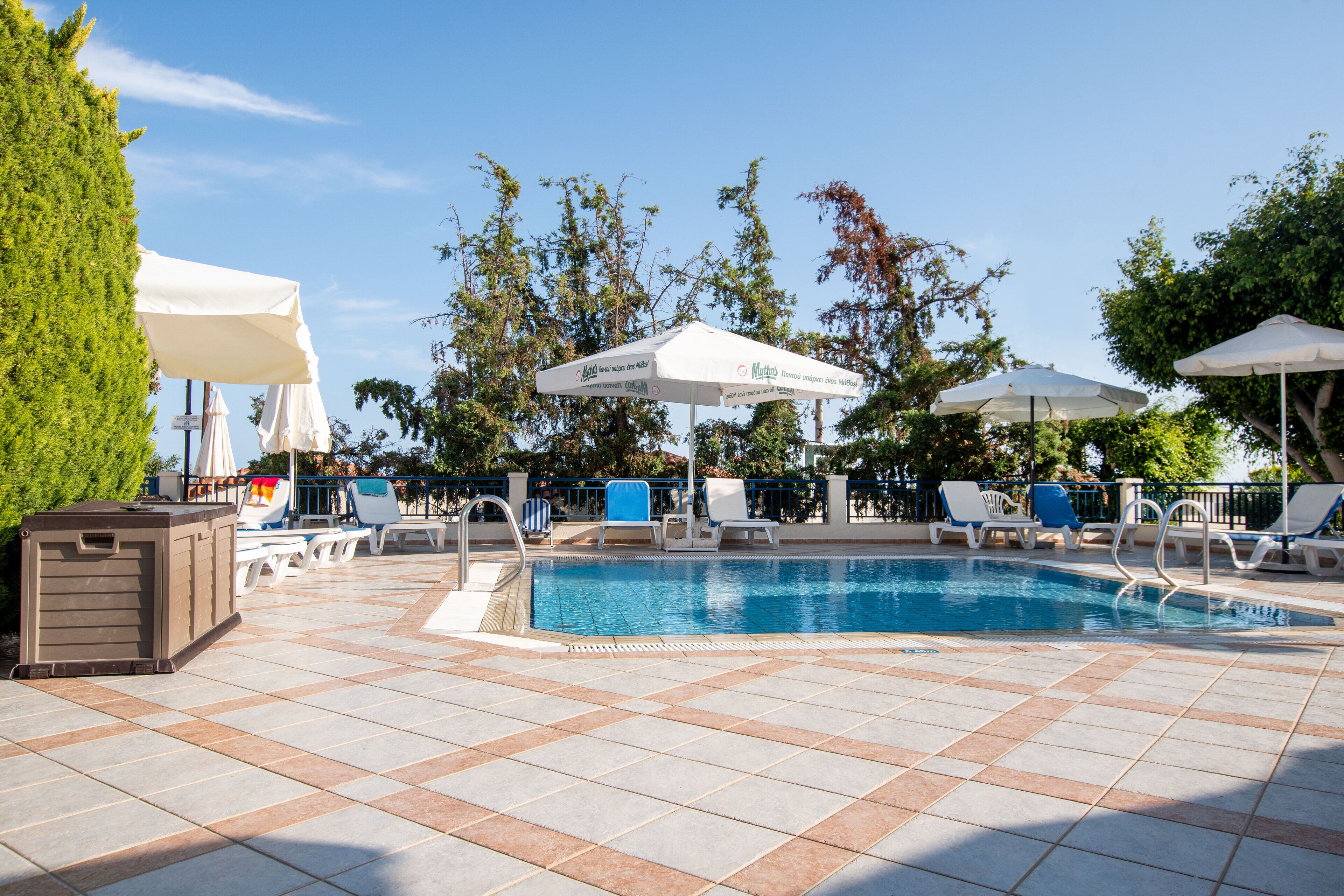 seasonal outdoor pool, pool umbrellas, pool loungers