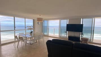 Apartment, 2 Bedrooms (Absolute Beach Front) | Living area | Flat-screen TV