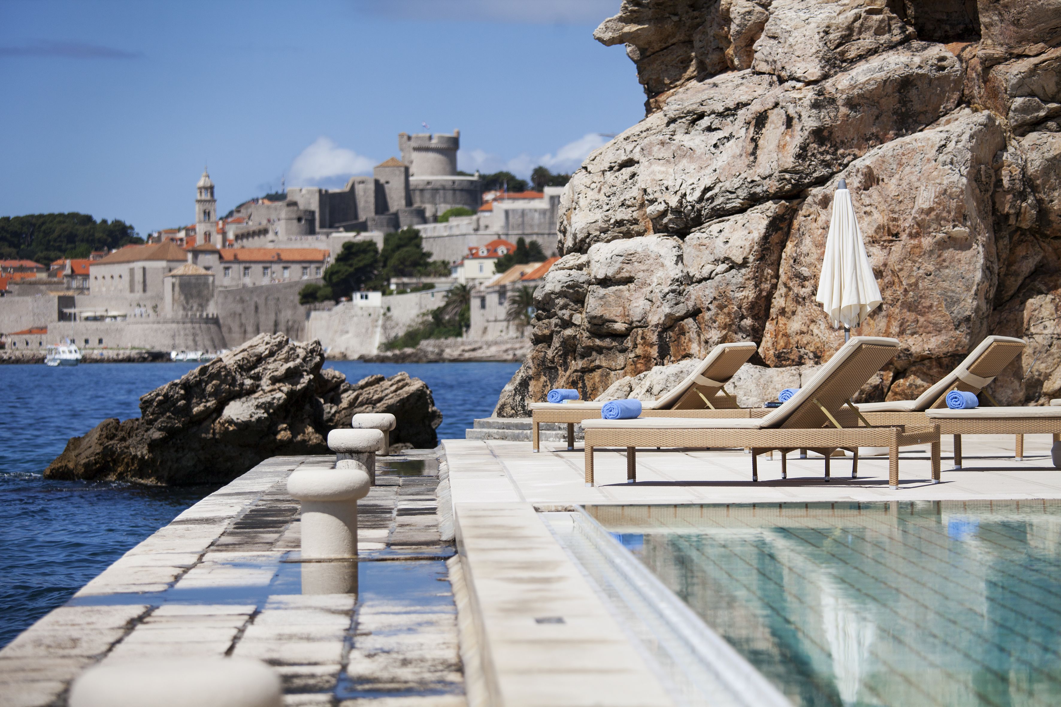 indoor pool, outdoor pool, pool umbrellas