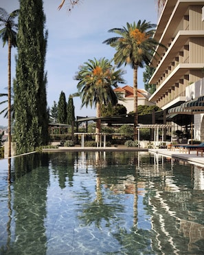 Indoor pool, outdoor pool, pool umbrellas, sun loungers