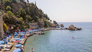 Beach shuttle, sun loungers, beach umbrellas