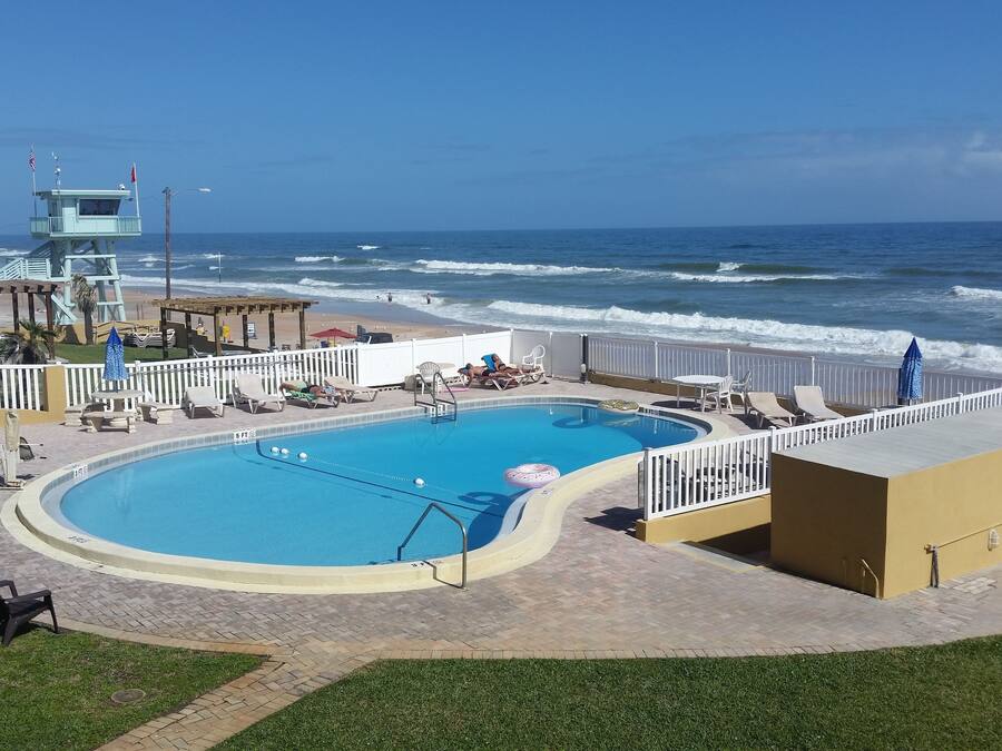 Outdoor pool, open 9:00 AM to 9:00 PM, pool loungers