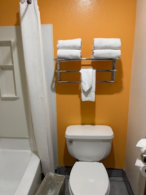 Bathtub, hair dryer, towels