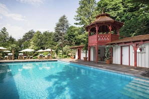 Seasonal outdoor pool, open 7:00 AM to 8:00 PM, pool umbrellas