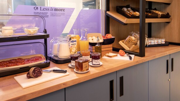 A breakfast buffet with various food items and condiments. - Font Andorra Hostel by Nexta (La Massana)