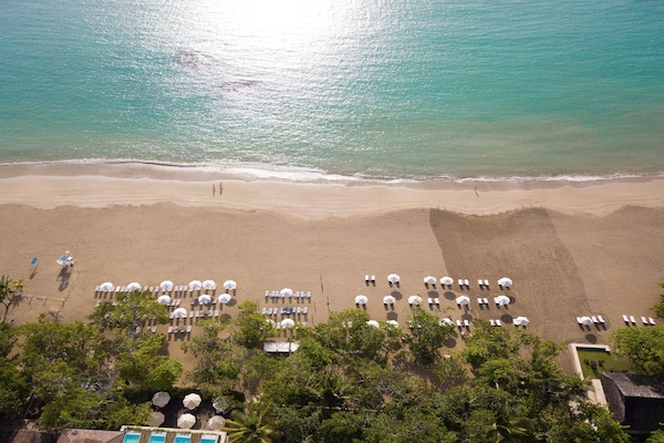 On the beach, sun loungers, beach umbrellas, beach towels