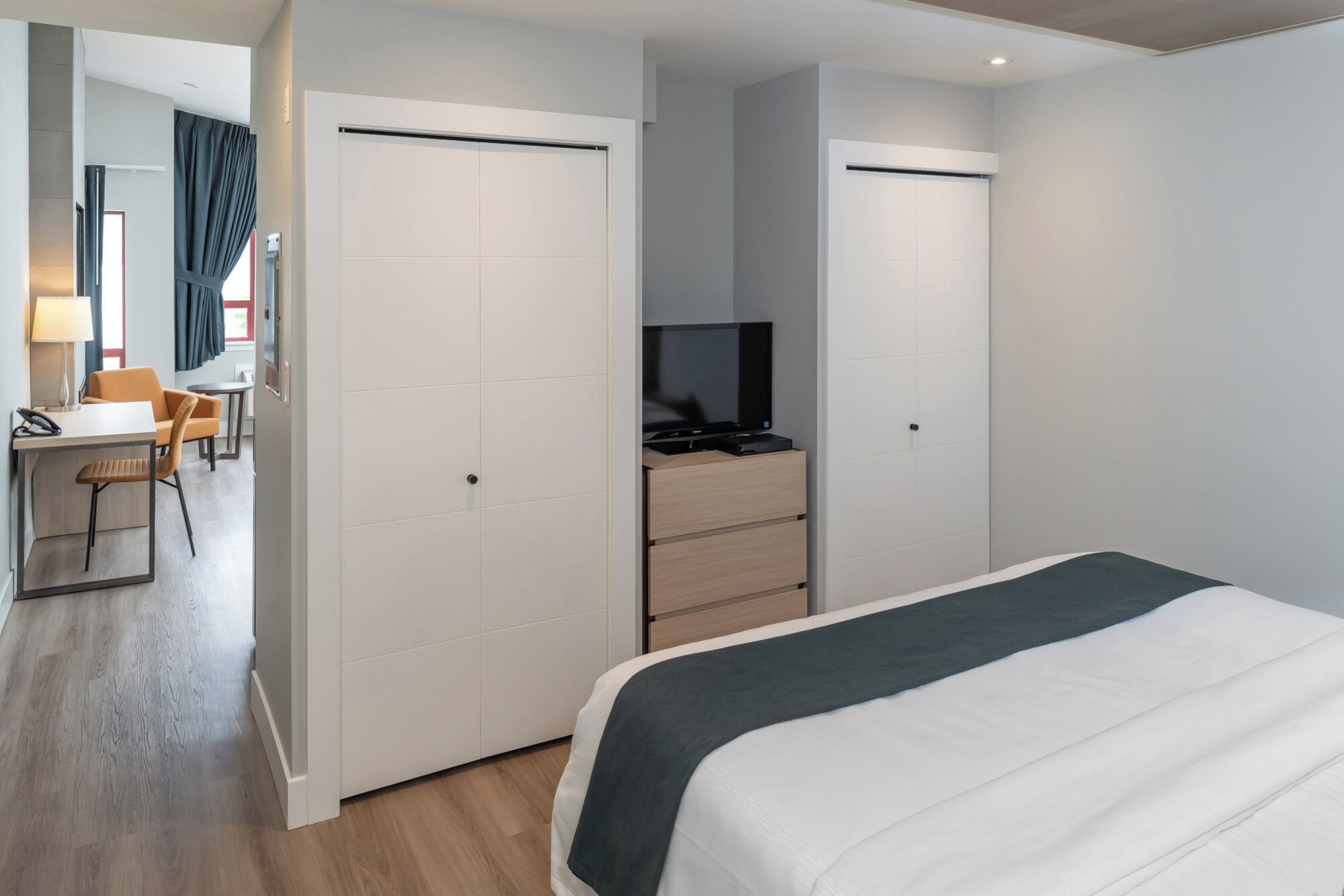 premium bedding, desk, blackout curtains, iron/ironing board