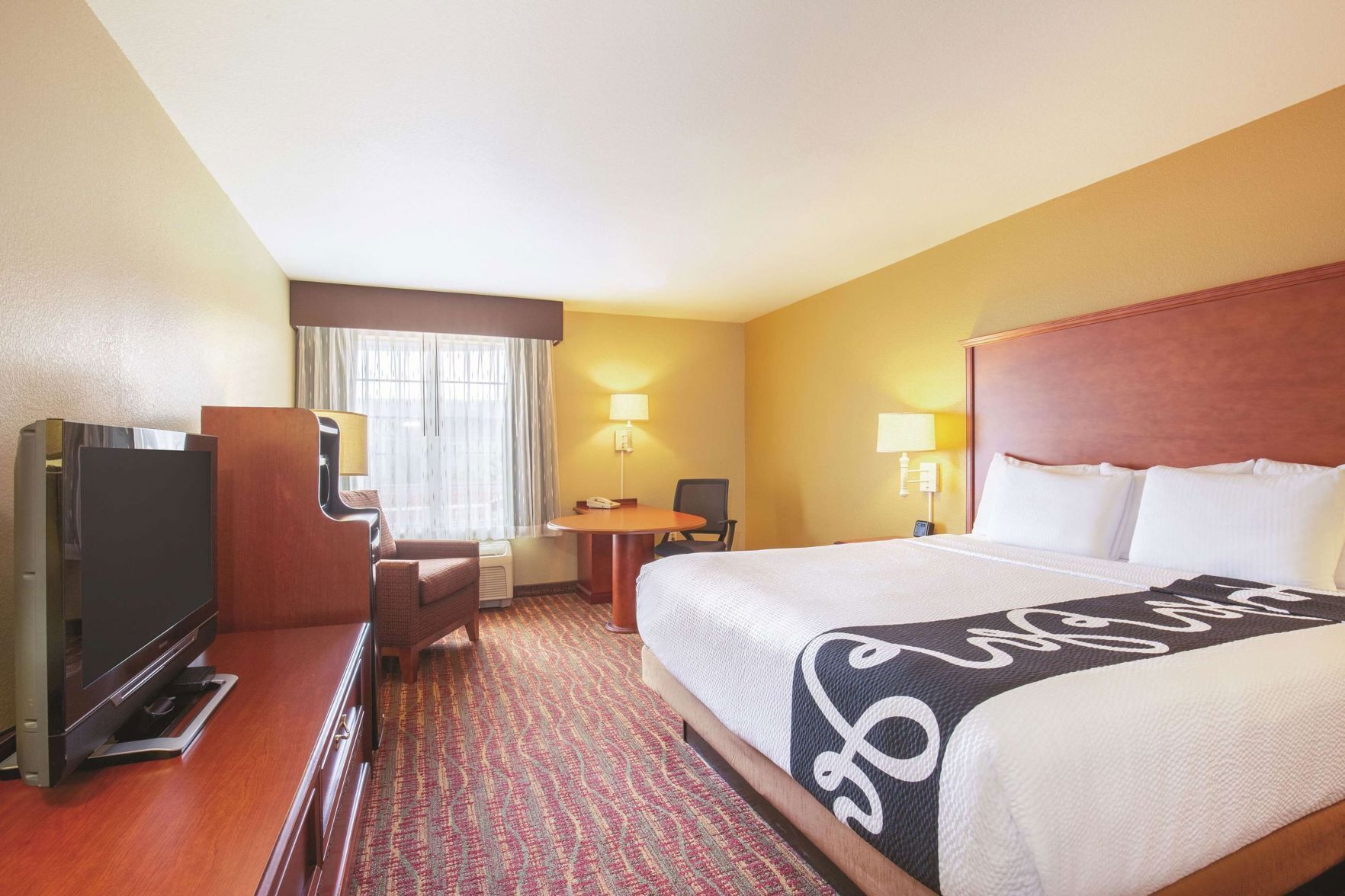 Premium bedding, pillow-top beds, desk, laptop workspace