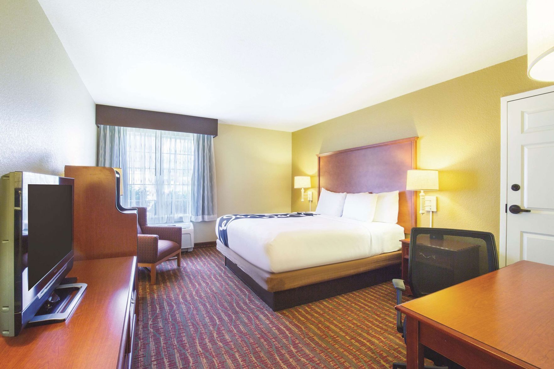 Premium bedding, pillow-top beds, desk, laptop workspace