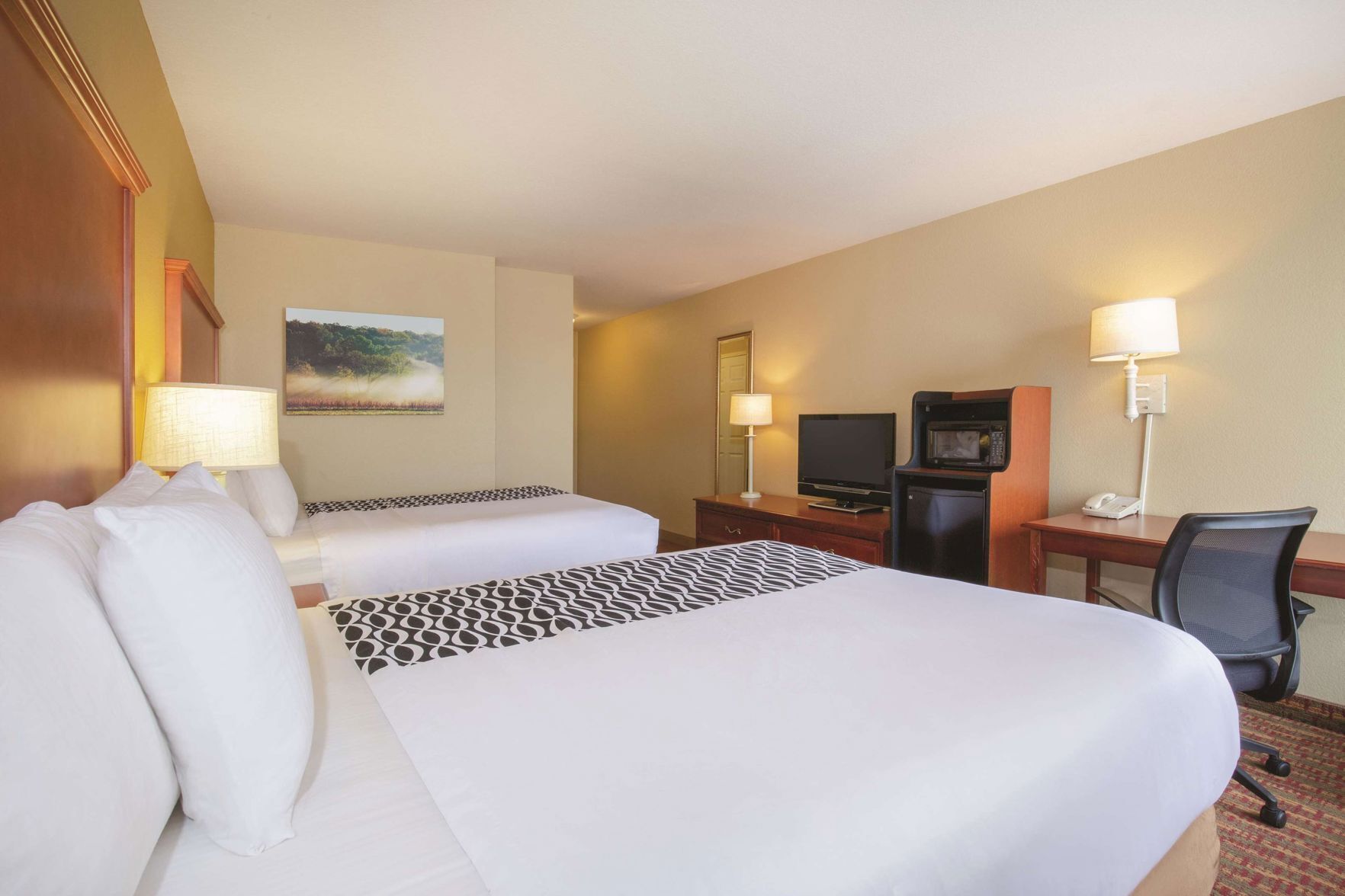 Premium bedding, pillow-top beds, desk, laptop workspace