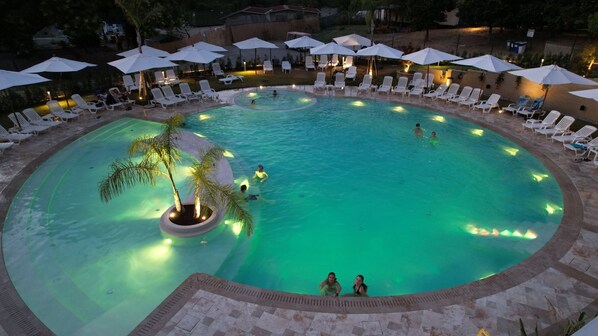 Seasonal outdoor pool, open 10:00 AM to 7:30 PM, pool umbrellas