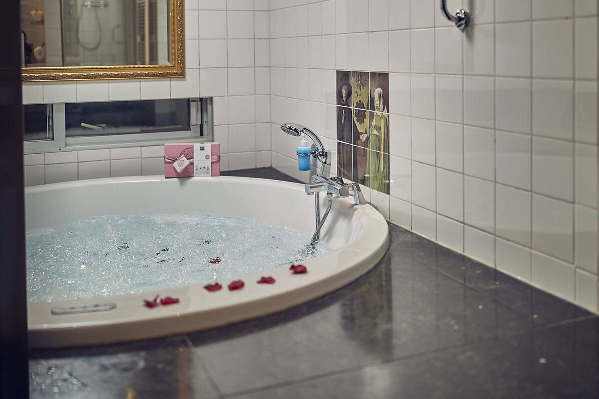 honeymoon suite, 1 king bed | bathroom | free toiletries, hair dryer, bathrobes, slippers