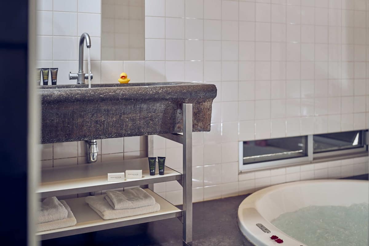 junior suite, 1 king bed | bathroom | free toiletries, hair dryer, bathrobes, slippers