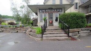 A building with a reception area labeled "King William Inn Reception." - Rodeway Inn King William (Huntsville)