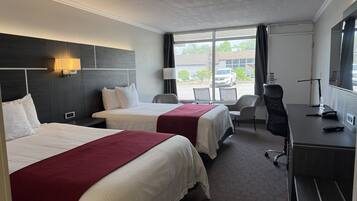 Room, 2 Queen Beds, Non Smoking | Living area | 32-inch TV with cable channels