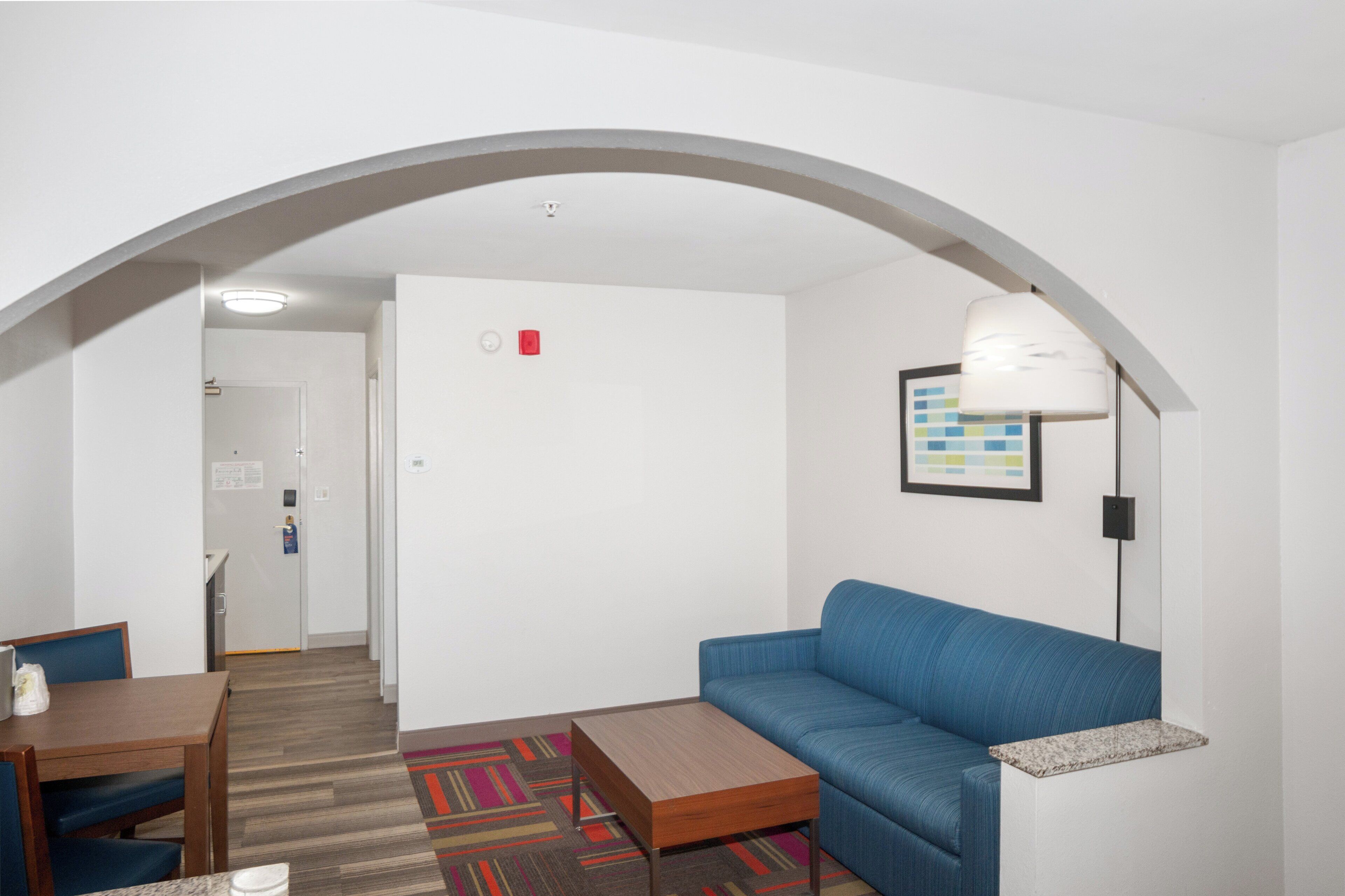 Desk, laptop workspace, blackout drapes, iron/ironing board