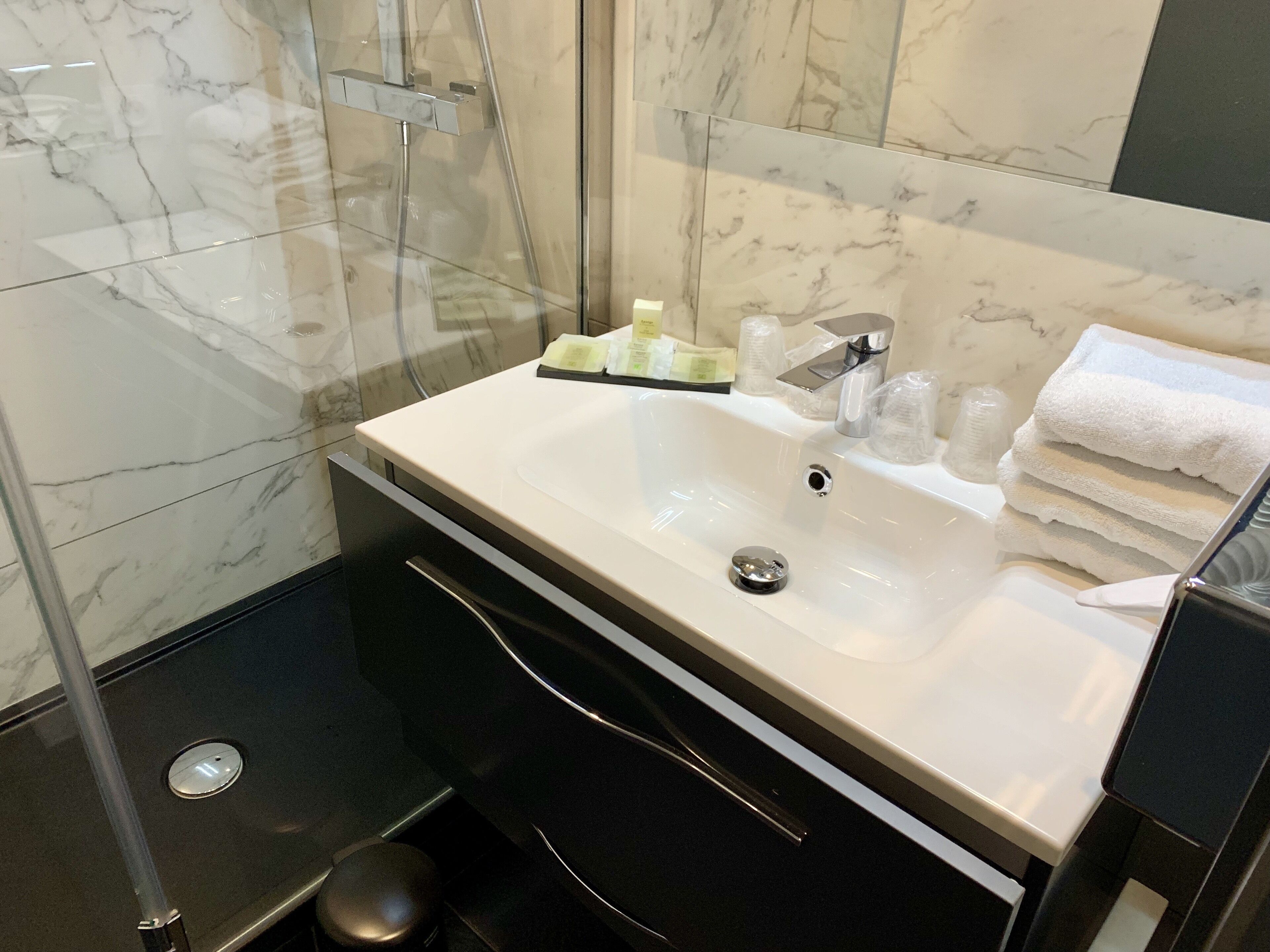 luxury room (superior) | bathroom | rainfall showerhead, hair dryer, towels