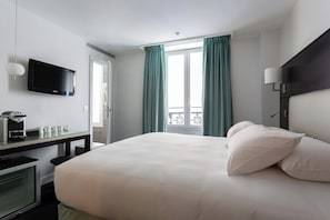 Luxe beddengoed, een minibar, een kluis op de kamer, een bureau