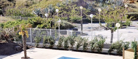 Seasonal outdoor pool, open 9:00 AM to 8:00 PM, pool umbrellas