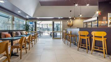 Breakfast, dinner served; local cuisine, pool views