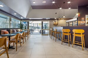 Breakfast, dinner served; local cuisine, pool views 