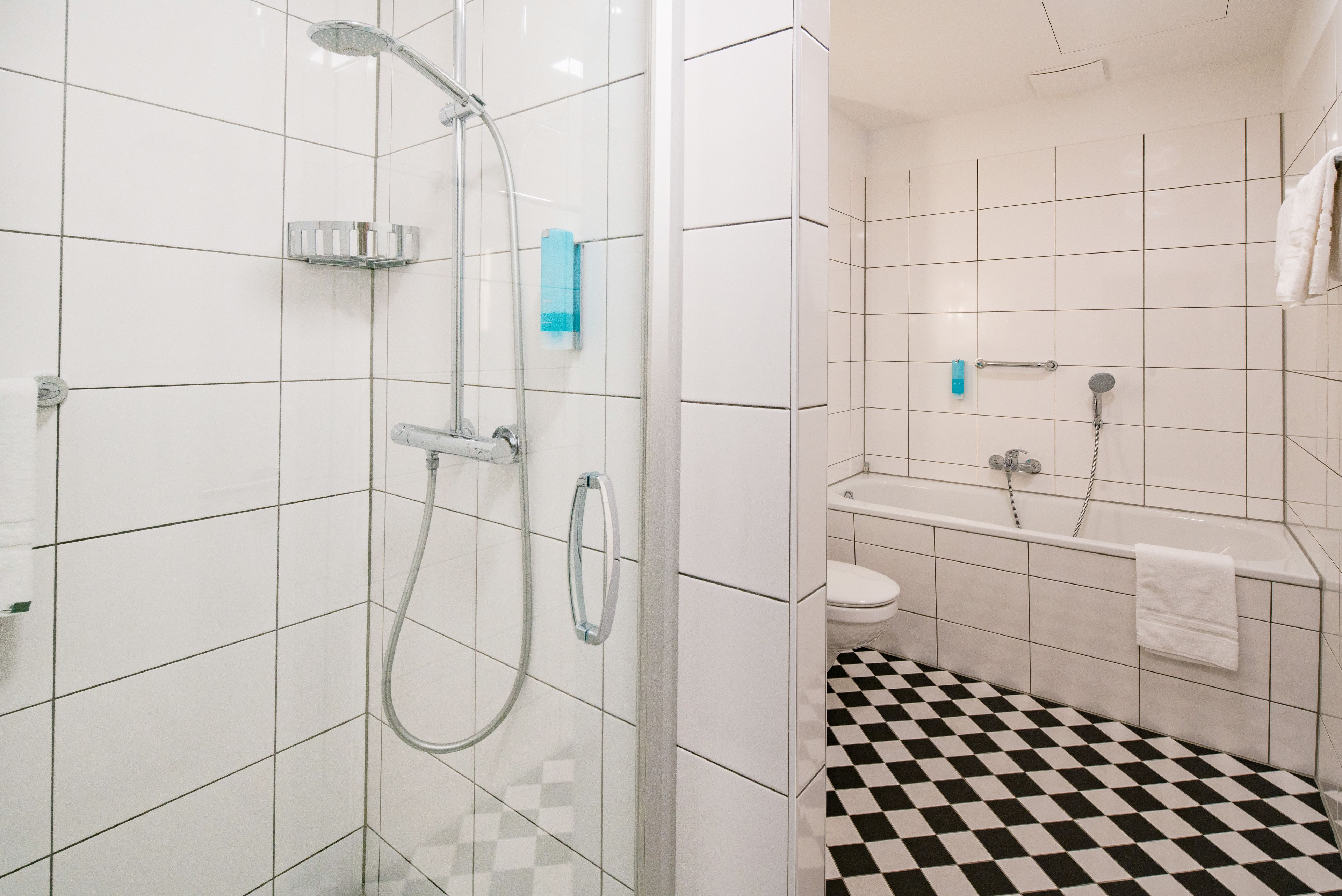 junior suite | bathroom | hair dryer, slippers, towels