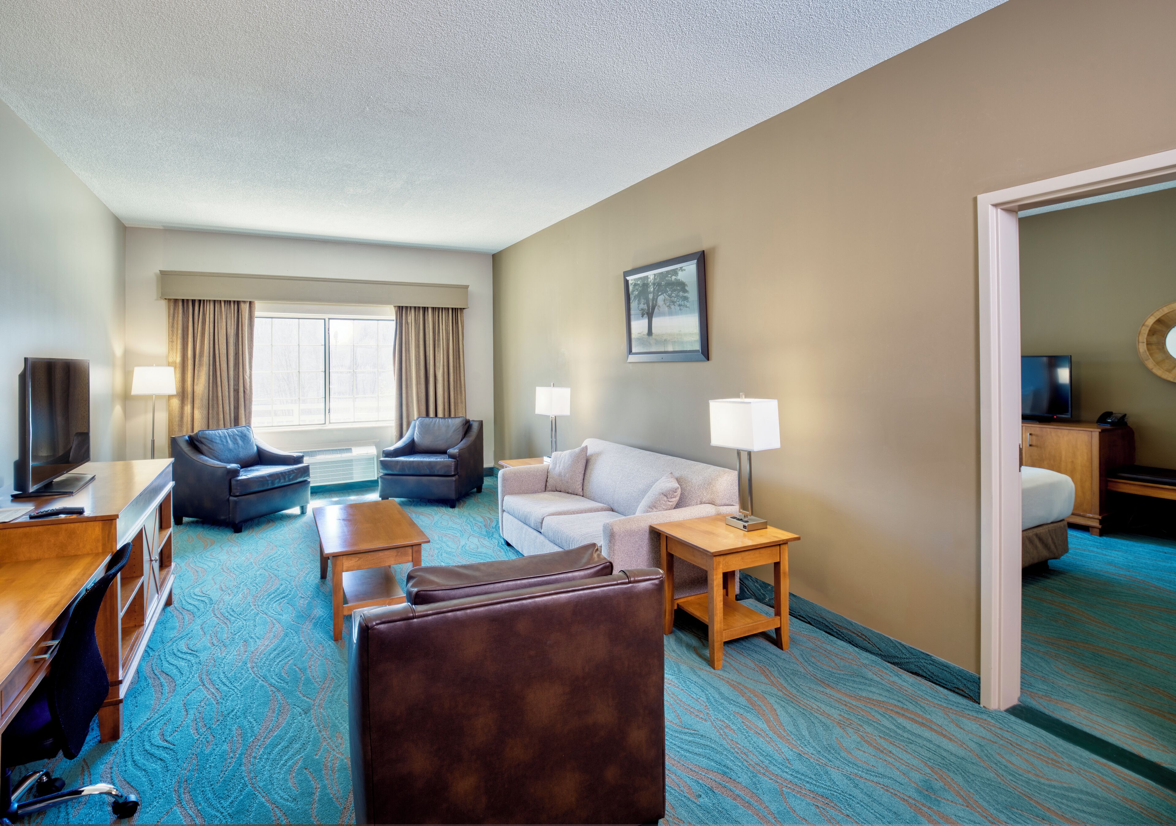 suite, 1 king bed | living area | 32-inch tv with cable channels, ipod dock