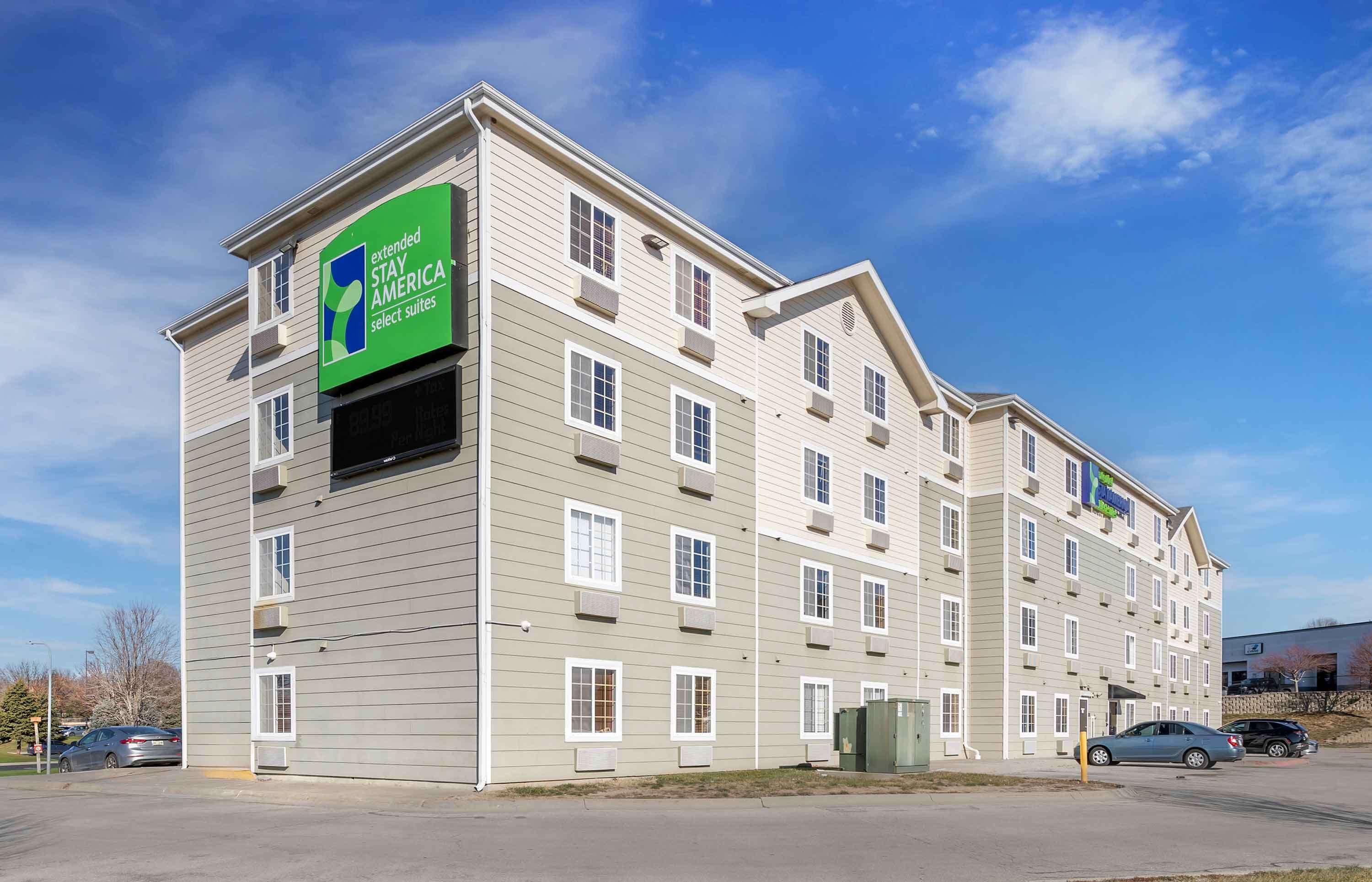 A multi-story hotel with a sign indicating it is part of the Extended Stay America brand.