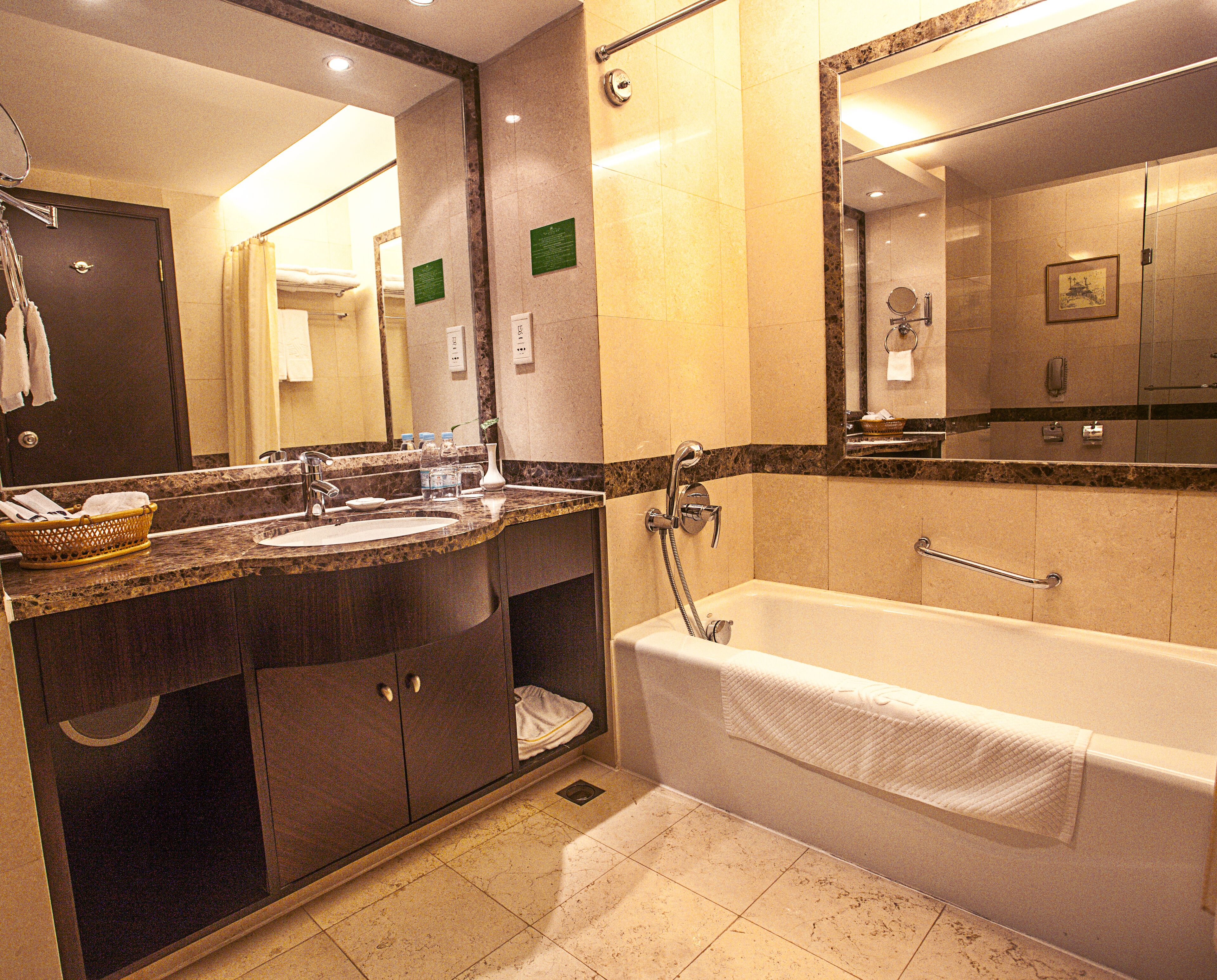 separate bathtub and shower, free toiletries, hair dryer, slippers