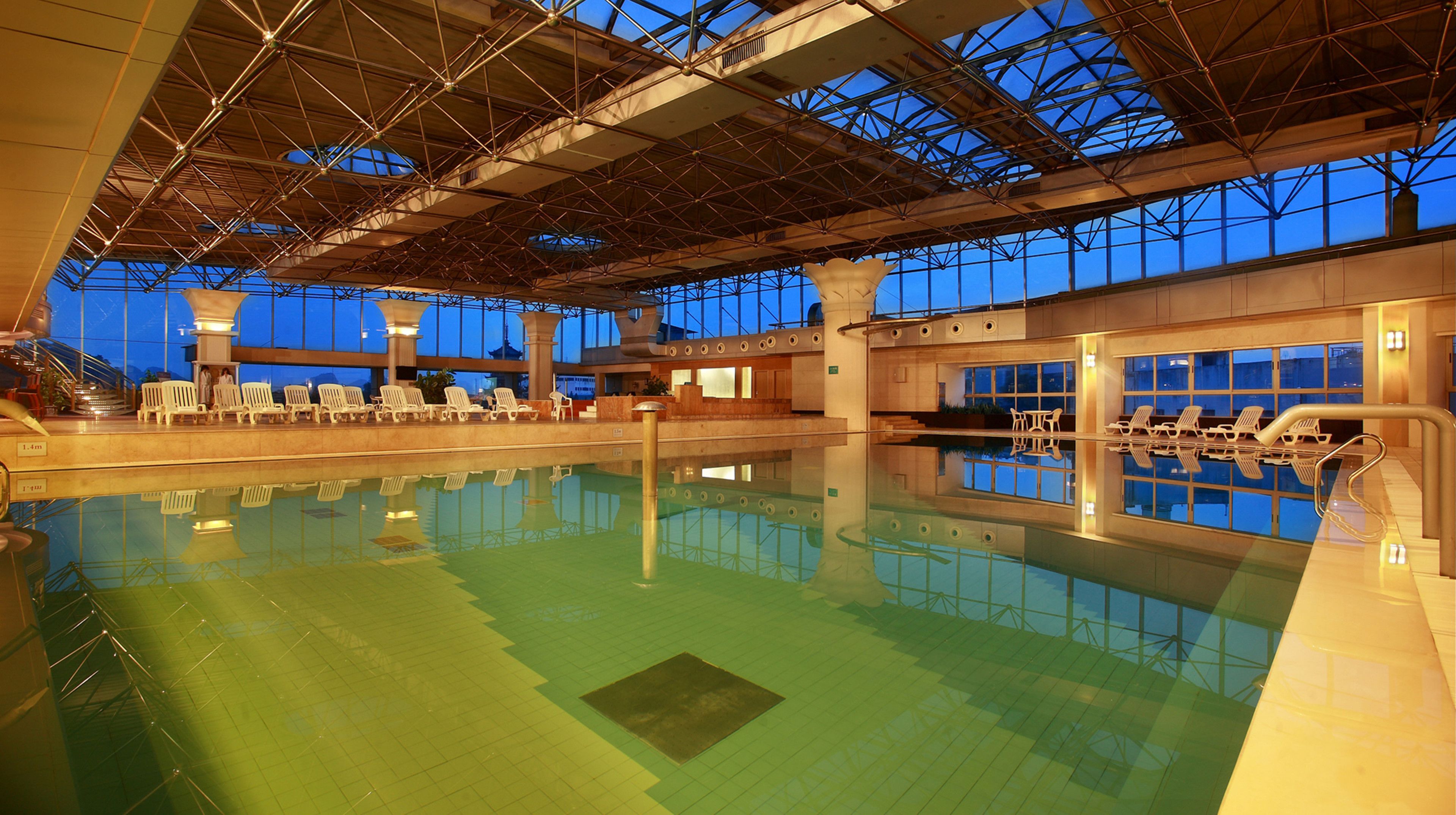 indoor pool, a lap pool, pool loungers
