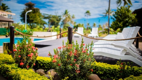 Outdoor pool, open 9:00 AM to 8:00 PM, pool umbrellas, pool loungers. Tanoa Rakiraki Hotel