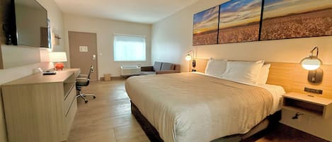 Suite, 1 King Bed, Non Smoking | In-room safe, desk, iron/ironing board, free wired Internet
