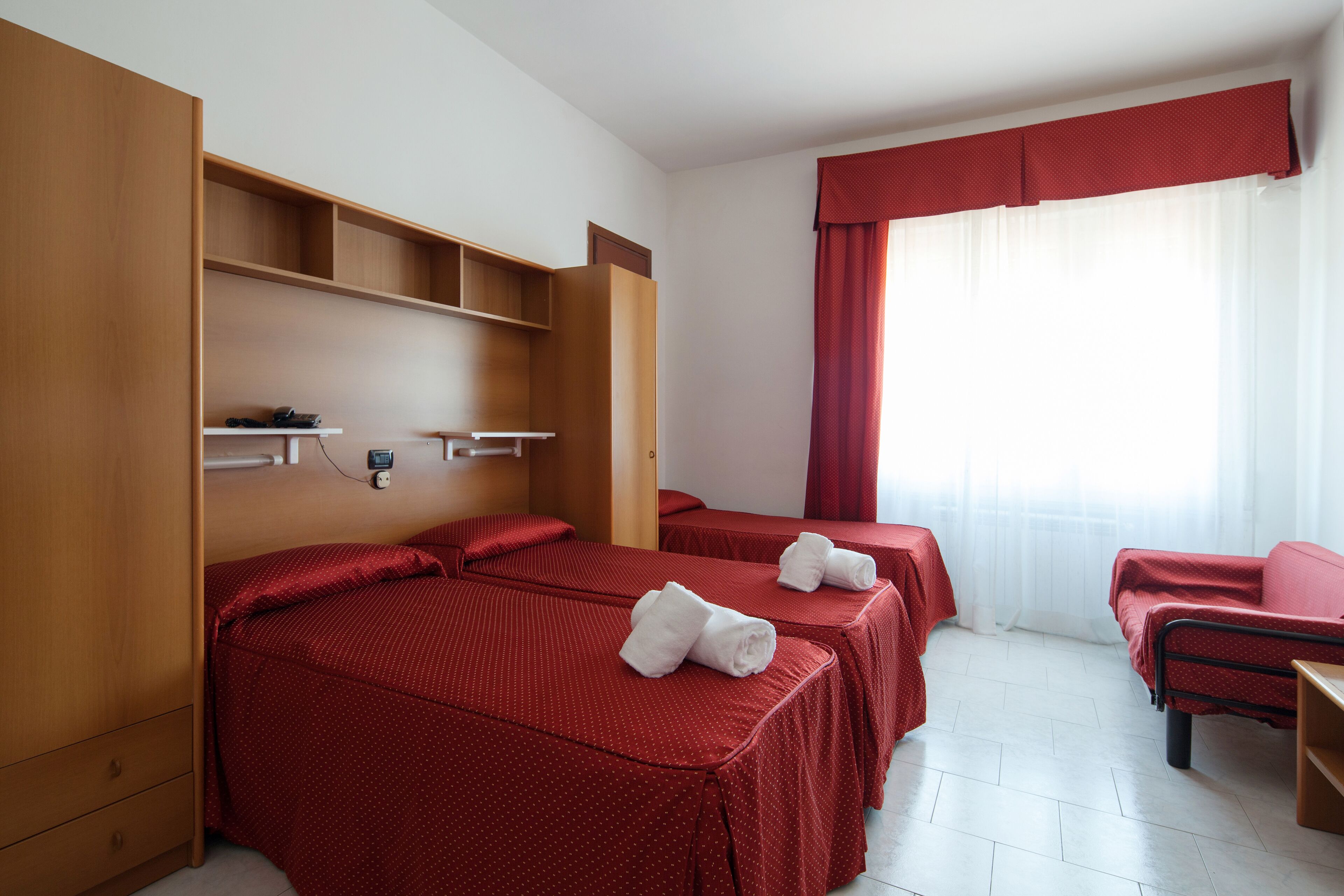 standard quadruple room | 1 bedroom, in-room safe, desk, blackout curtains