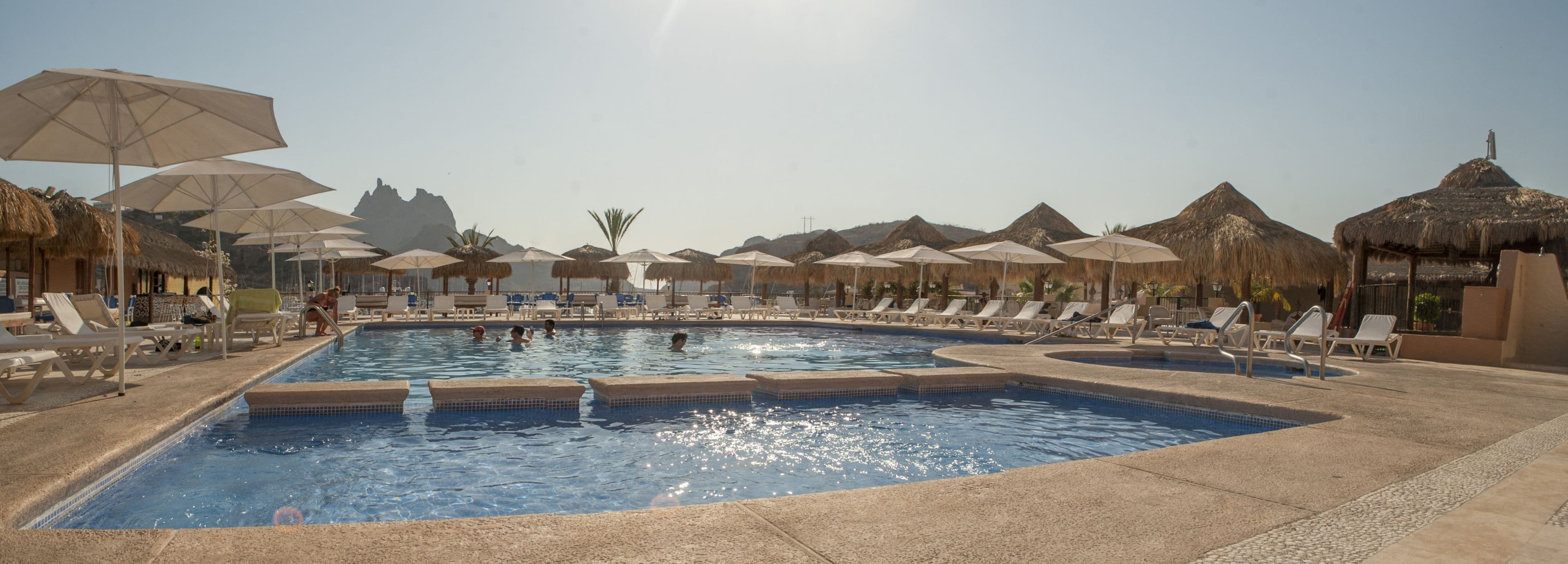 2 outdoor pools, open 7:00 AM to 9:00 PM, pool umbrellas