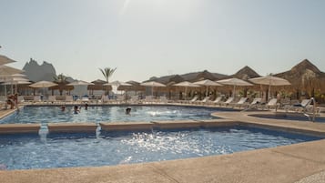 2 outdoor pools, open 7:00 AM to 9:00 PM, pool umbrellas