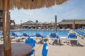 2 outdoor pools, open 7:00 AM to 9:00 PM, pool umbrellas
