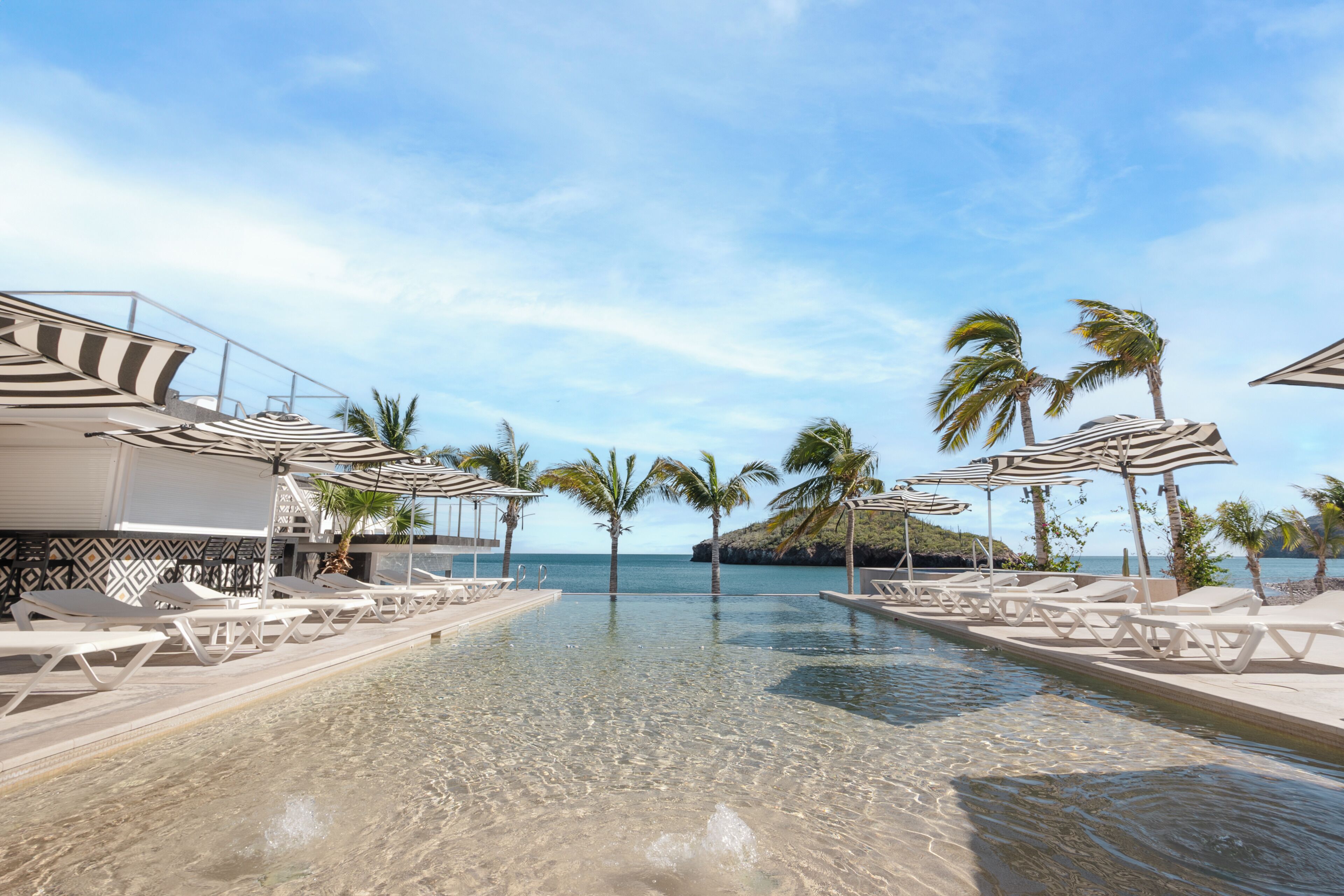 2 outdoor pools, open 7:00 AM to 9:00 PM, pool umbrellas