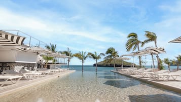 2 outdoor pools, open 7:00 AM to 9:00 PM, pool umbrellas