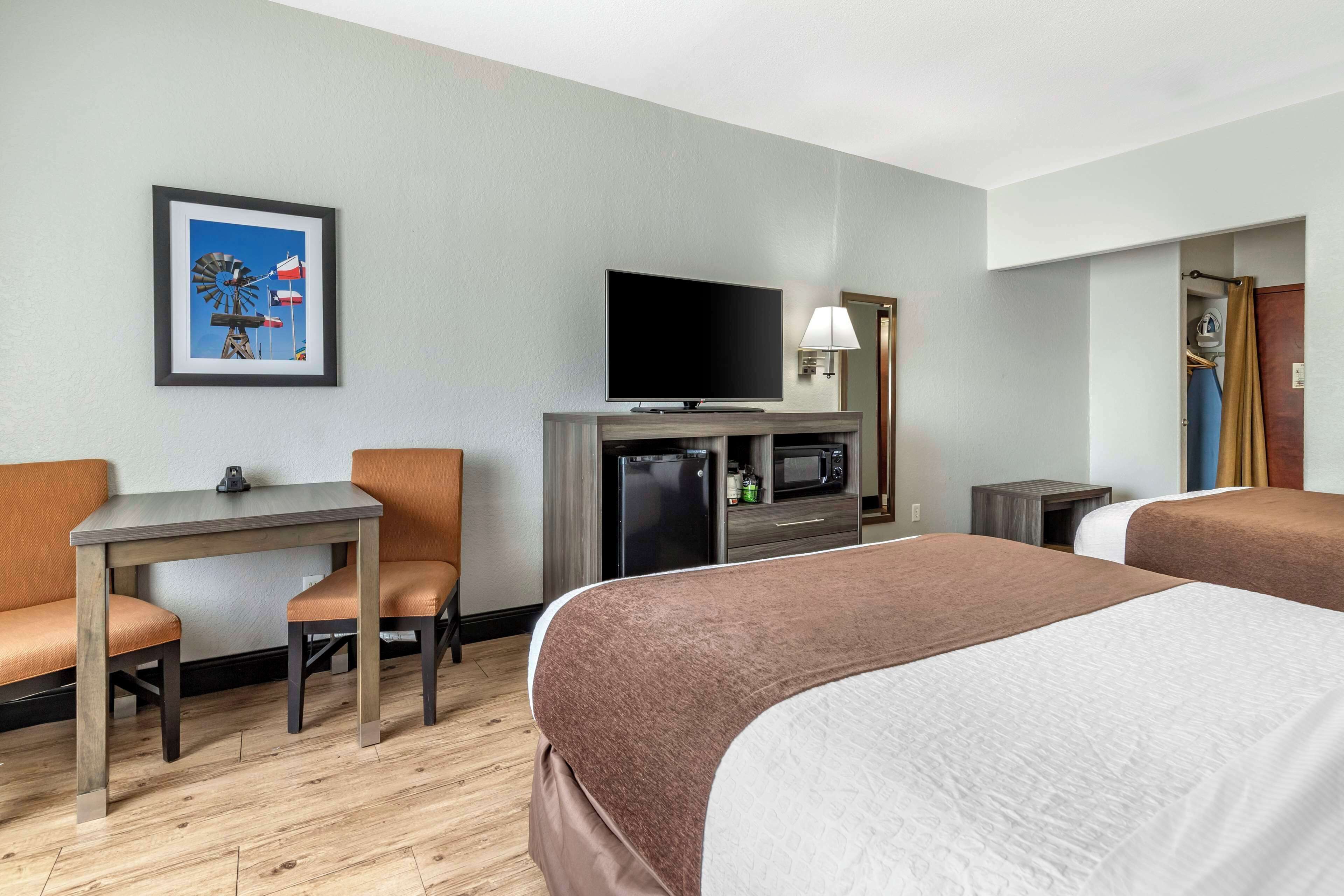 standard room, 2 queen beds, non smoking, microwave | pillow-top beds, desk, laptop workspace, blackout curtains