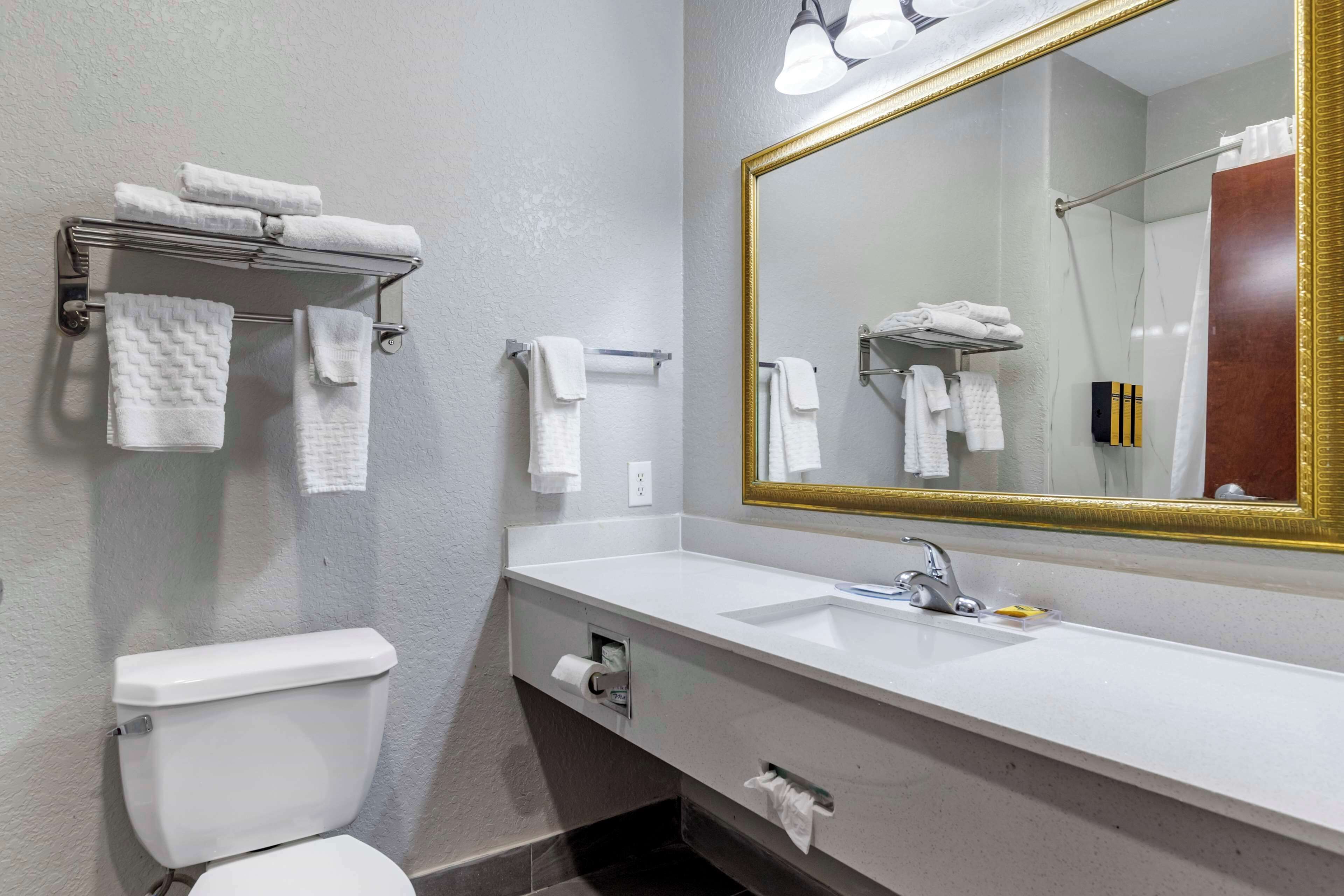 suite, 1 king bed, non smoking, refrigerator & microwave | bathroom | combined shower/bathtub, hydromassage showerhead, free toiletries