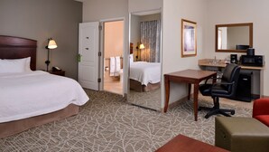 A hotel room with a bed, a desk, a chair, a microwave, a coffee maker, and a small table. - Hampton Inn by Hilton Litchfield (Litchfield)