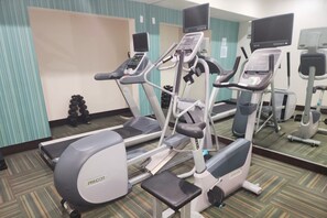 A gym with treadmills, ellipticals, and free weights. - Holiday Inn Express Hotel & Suites Decatur by IHG (Decatur)
