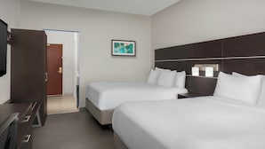 A hotel room with two beds, a desk, a TV, and a framed picture on the wall. - Holiday Inn Express Knoxville-Strawberry Plains by IHG (Knoxville)