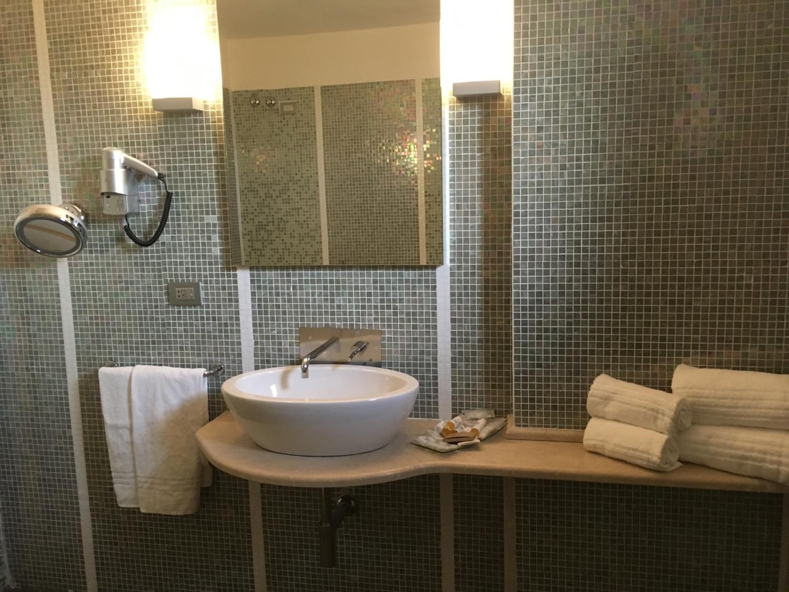 free toiletries, hair dryer, slippers, bidet