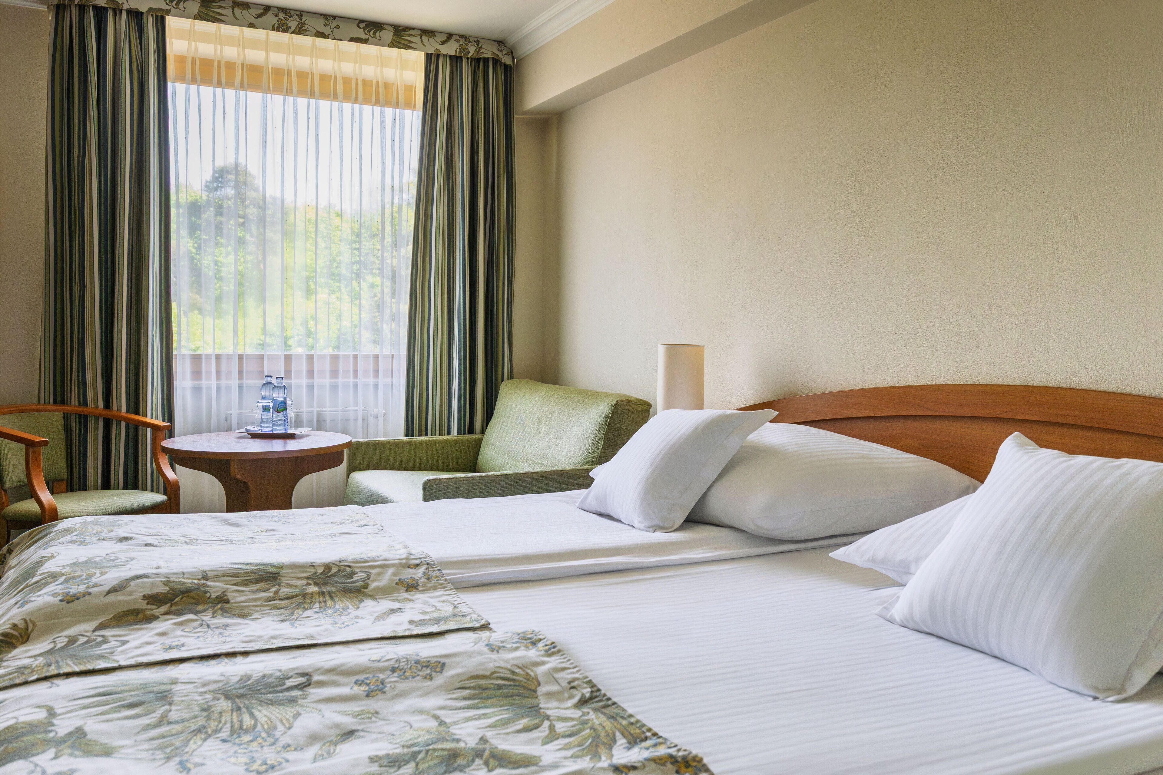 premium bedding, desk, laptop workspace, blackout curtains