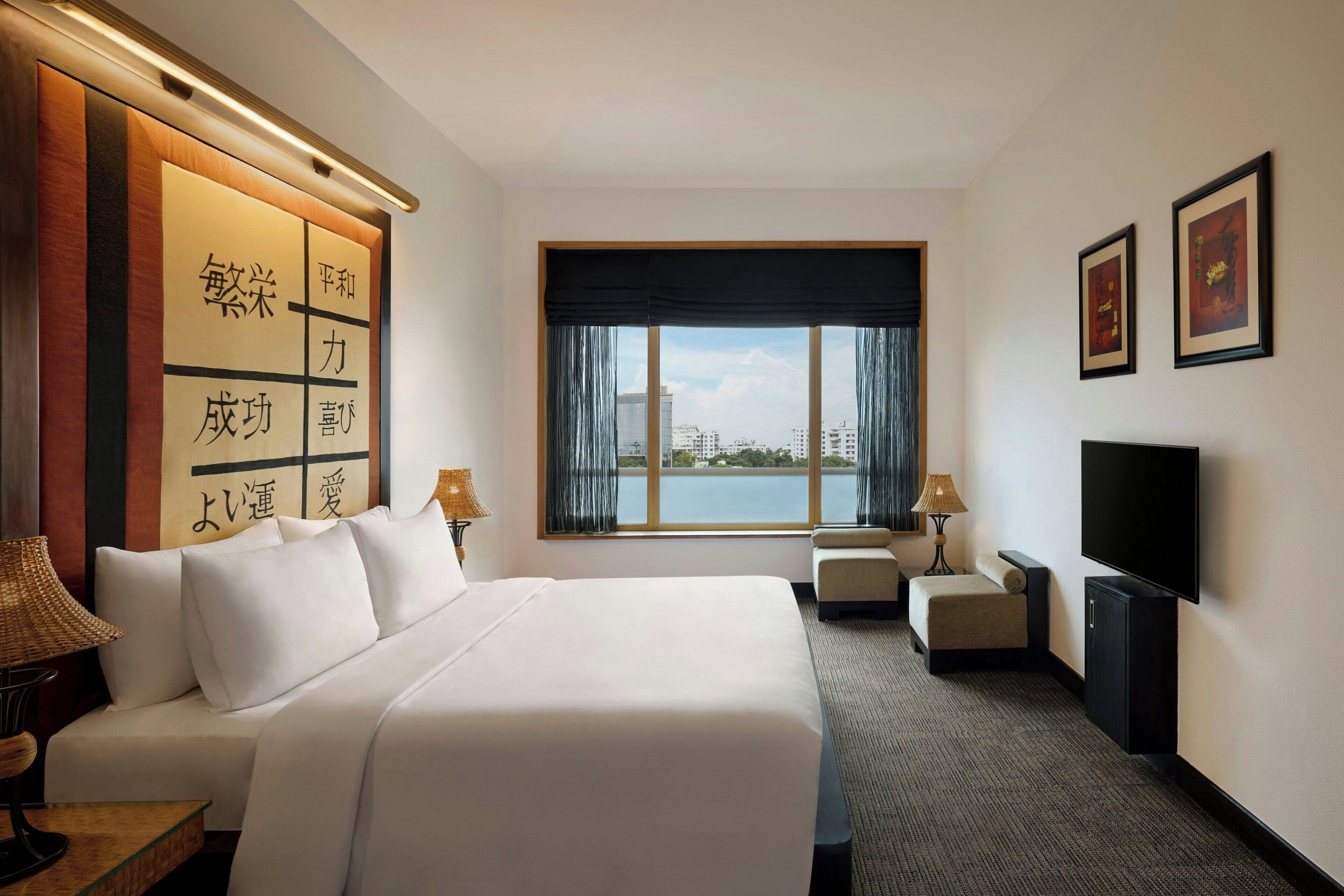 Suite, 1 King Bed, City View | Minibar, in-room safe, desk, iron/ironing board