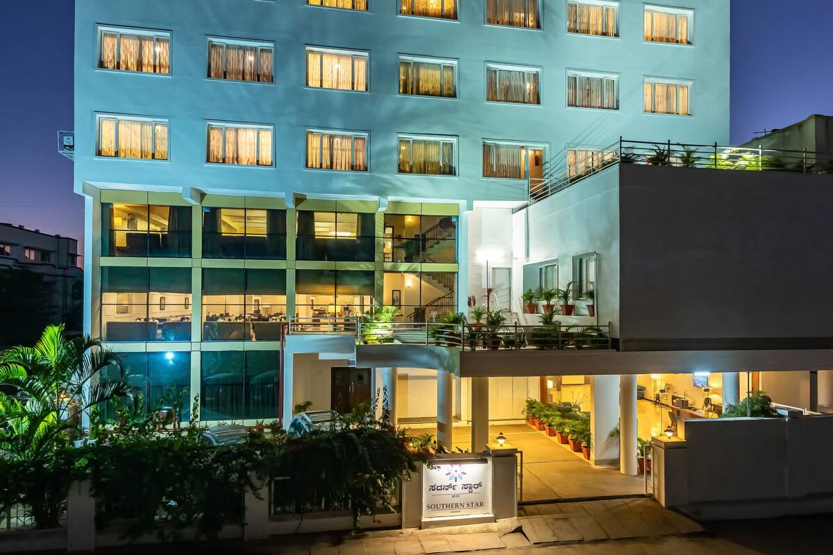 A multi-story hotel with illuminated windows and a sign reading "Southern Star".