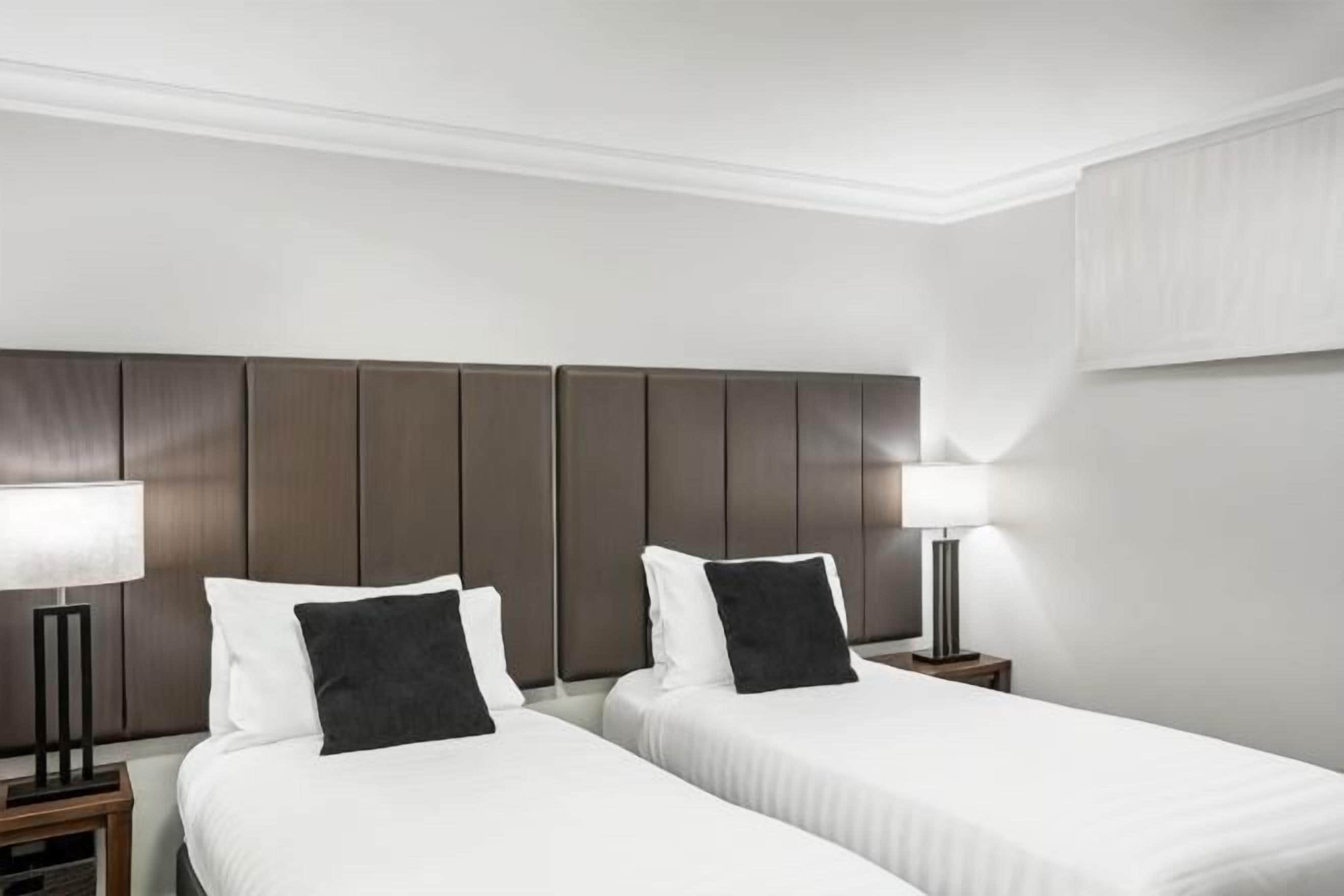Premium bedding, desk, laptop workspace, iron/ironing board